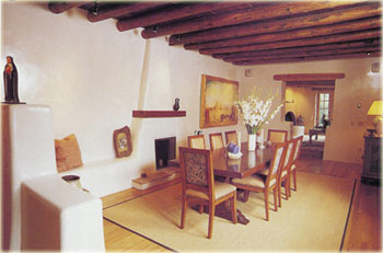 Dining room with plastered adobe walls